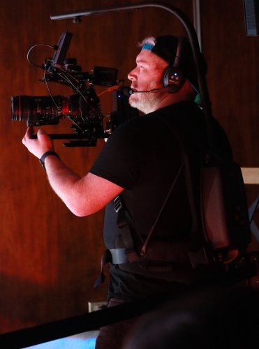 Timothy Robbins filming with an Easyrig on a Catholic production set